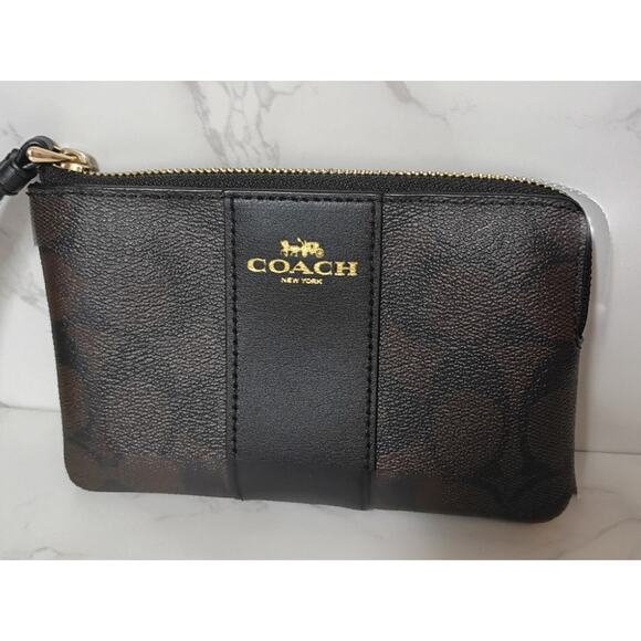 Coach Handbags - COACH Brown Monogram & Black Leather Trim Wristlet - EUC